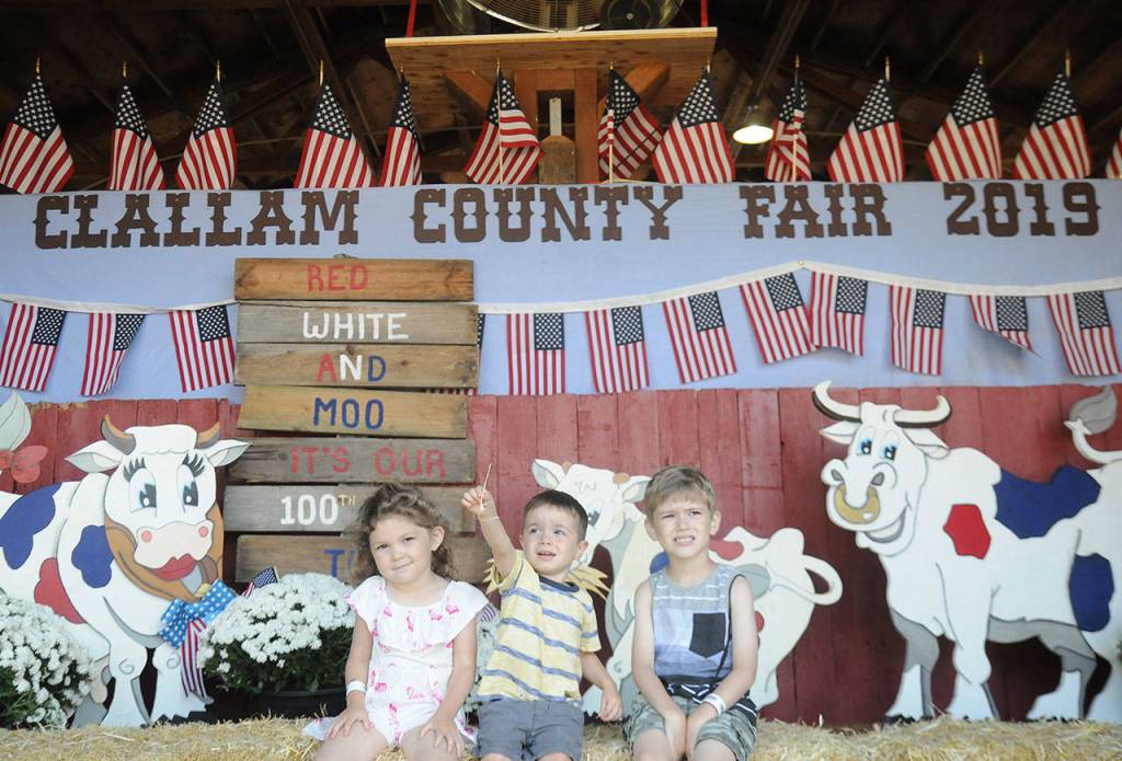 From left, Anabelle Stringham, 4, Nicky Hendrickson, 2, and Wyatt Stringham, 5, enjoy the first day of the Clallam County Fair on Thursday. The Stringhams are from Port Angeles; Hendrickson is from Forks. Michael Dashiell/Olympic Peninsula News Group