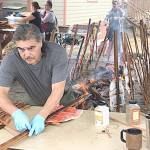 Monty McAlpin prepares sockeye salmon filets that were caught for the 2018 Makah Days salmon bake. (Paul Gottlieb/Peninsula Daily News)