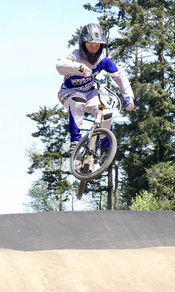 Dave Logan/for Peninsula Daily News Port Angeles Brian Belbin flies over a hill at the Lincoln Park BMX track earlier this year.