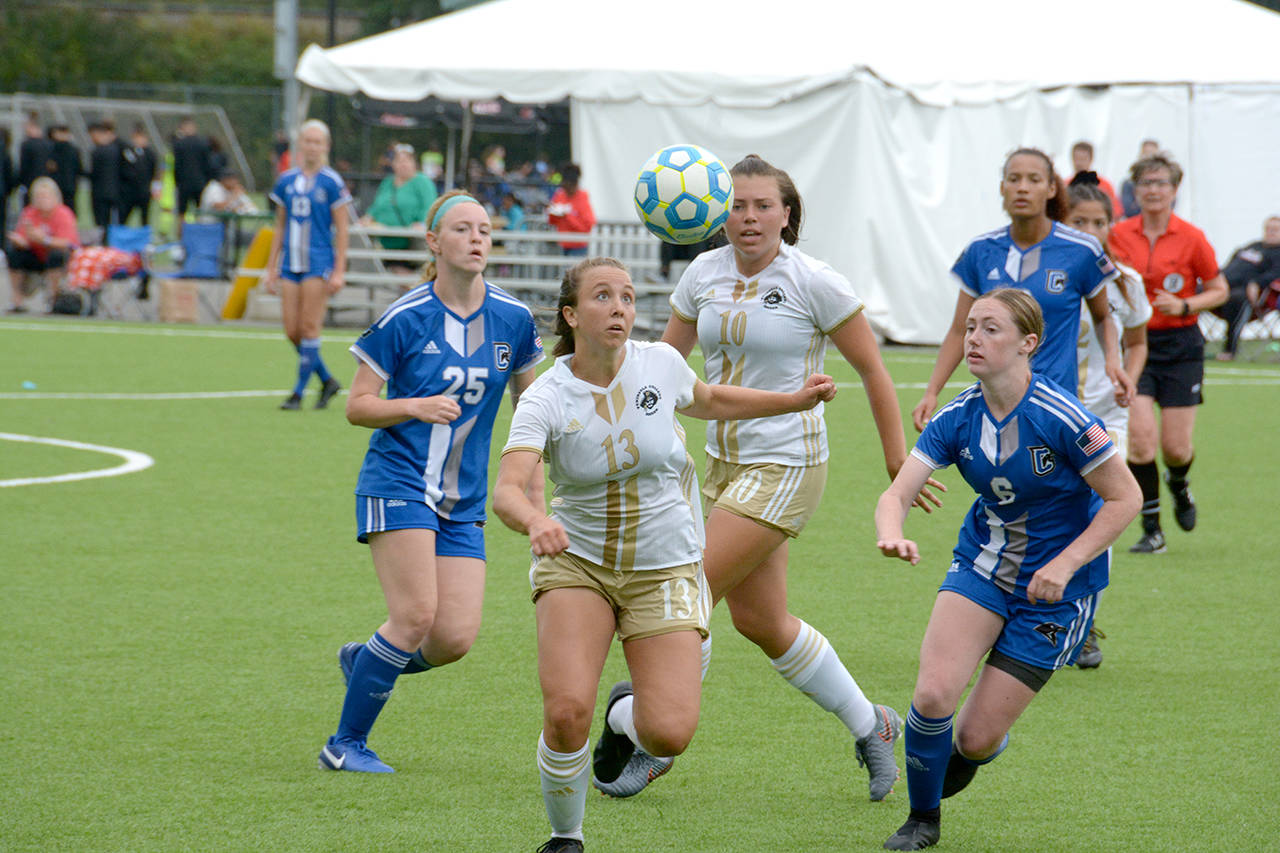 Courtesy Peninsula College Peninsulas Grace Hipke, front, eyes the ball, while the Pirates Grace Johnson, looks on during a 3-1 win over Clark on Thursday.