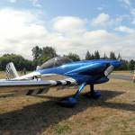 Forrest Davis of Sequim looks at a Vans Aircraft RV-4 parked on the tarmac during Saturdays Olympic Peninsula Air Affaire at Sequim Valley Airport. (Keith Thorpe/Peninsula Daily News)