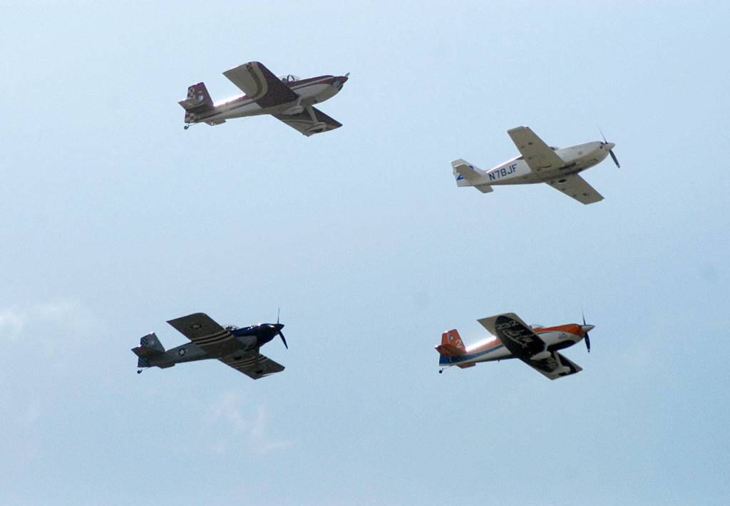 Four aircraft belonging to the Arlington-based Blackjack Squadron fly in formation above Sequim Valley Airport during Saturdays Air Affaire and Sequim Valley Fly-In. (Keith Thorpe/Peninsula Daily News)