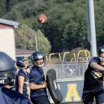 Lonnie Archibald/for Peninsula Daily News Forks Carter Windle throws the football during a preseason practice.