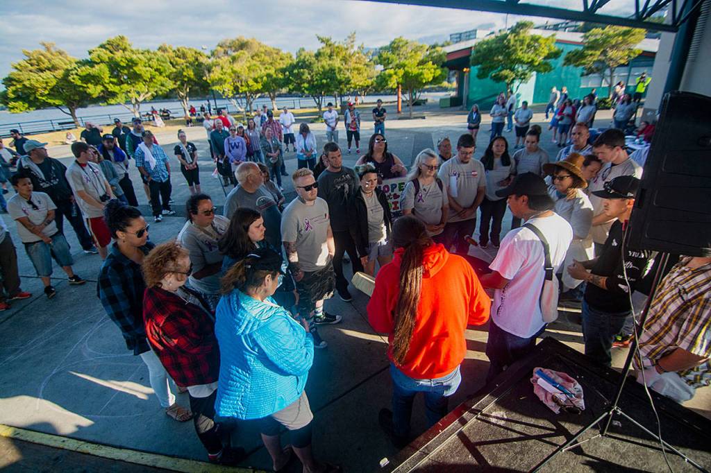 Tribal drummers sing a song of healing for those who have had loved ones die from an overdose. (Jesse Major/Peninsula Daily News)