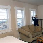 Lynae Hall of Port Angeles takes a photograph of the view from one of the hotels deluxe rooms. (Keith Thorpe/Peninsula Daily News)