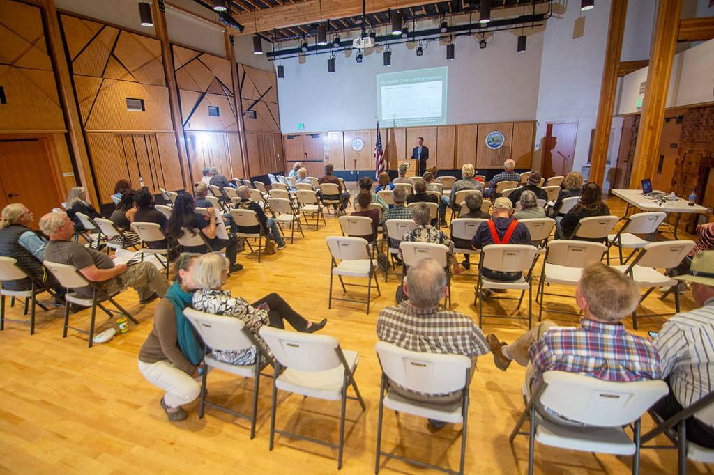 U.S. Rep. Derek Kilmer, D-Gig Harbor, addresses a crowd during a town hall at the Rainforest Arts Center in Forks on Wednesday evening. (Jesse Major/Peninsula Daily News)