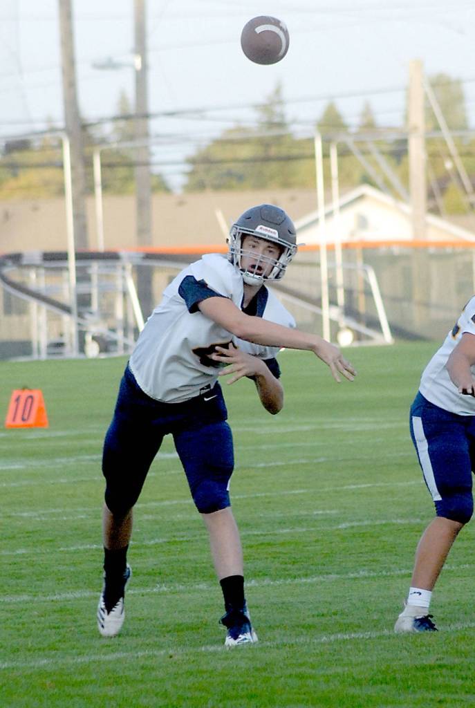Keith Thorpe/Peninsula Daily News Forks quarterback Carter Windle passes in the first quarter on Friday against Port Angeles.