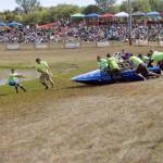 An island hopper safety crew pulls the Blue Bayou super modified boat driven by Clayton Hatch and navigated by Dylan Hatch back to the course after the boat leaped from the water and slid into a fence Saturday. (Keith Thorpe/Peninsula Daily News)