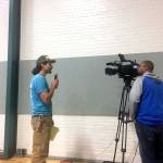 Tyson Minck directs his comments at the Southern Resident Killer Whale Task Force meeting to Gov. Jay Inslee through a video camera Monday. The task force held a day-long meeting at the Vern Burton Community Center in Port Angeles. (Rob Ollikainen/Peninsula Daily News)