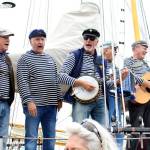 The Shifty Sailors perform on the boat Suva at the Wooden Boat Festival in Port Townsend. (Zach Jablonski/Peninsula Daily News)