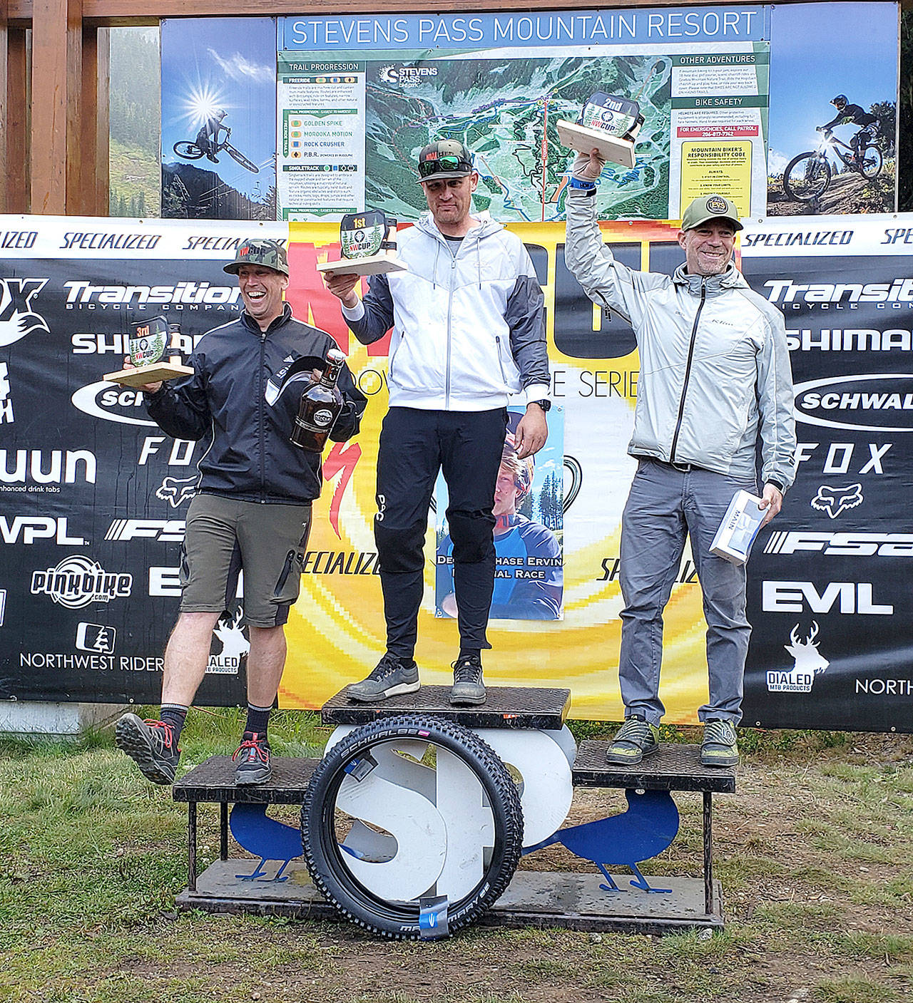 Travis Bear of Sequim, center, won the Northwest Cup championship for the mens Cat 3 40-59 division. Bear had seven top 3 finishes in NW Cup races this spring and summer, dominating his division.