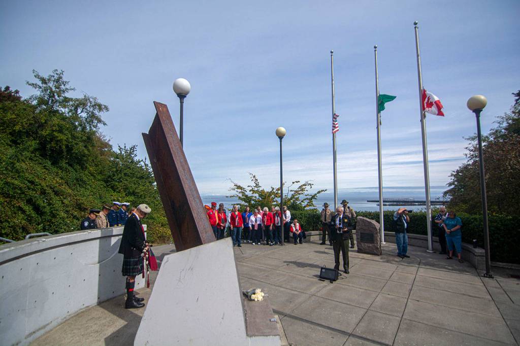Clallam County Sheriffs Chaplain Ed Evans says a prayer during a ceremony in Port Angeles honoring public safety officials on the 18th anniversary of the 9/11 terrorist attacks Wednesday. (Jesse Major/Peninsula Daily News)