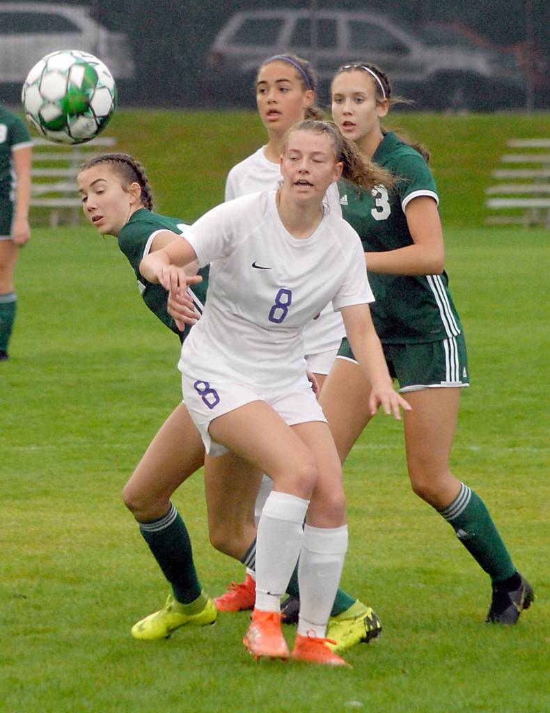 Keith Thorpe/Peninsula Daily News A loose ball bounces away from Sequims Autumn Hilliard, front, and, from left, Port Angeles Catherine Brown, Sequims Hope Glasser and Hannah Reetz of Port Angeles on Thursday evening at Port Angeles Civic Field.