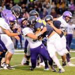Sequim linebacker Isaiah Cowan makes a stop on Forks running back Ricardo Barragan on Friday at Spartan Stadium.