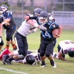 <strong>Steve Mullensky</strong>/for Peninsula Daily News                                Chimacums Anson Jones in the Cowboys new black uniforms runs for yardage in a game against the Tenino Beavers on Friday at Memorial Field in Port Townsend.