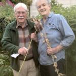 Bob Cain, left, and Muriel Nesbitt pose in the Fifth Street Community Garden in Port Angeles, where a variety of non-hybrid seeds are sown. (Betty Harriman)