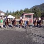 Living Well Farm owner/instructor Nancy McCaleb teaches fun, informative lessons year-round. She is shown here with some of her students. They are, from left, Alyssa Romero, Sydney Day, Sara Holland, Kennady Gilbertson, Lillian Bond, McCaleb, Jeana Hutton, Ella Garcelon, Katie Marchant and Gwyneth Van Blair. (Karen Griffiths/for Peninsula Daily News)
