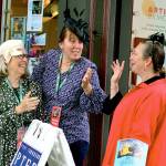 Concierges Pam Gould, left, and Susanna Sharp station themselves with maitre dhotel Amanda Steurer-Zamora, right, at the Port Townsend Film Festivals Northwind Arts Center hospitality suite Thursday morning. (Diane Urbani de la Paz/for Peninsula Daily News)