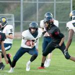 PREP FOOTBALL: Spartans’ Baker runs wild in win over Redhawks