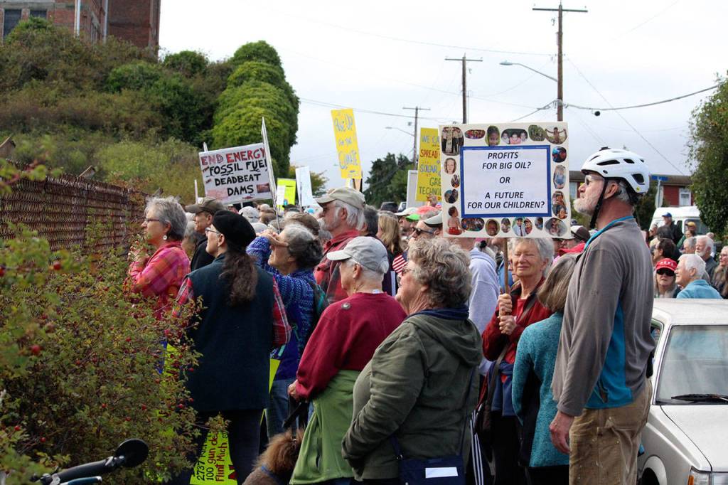 Hundreds of adults stood outside the Port Townsend High School baseball field in solidarity with the youth rally that the students led for Global Climate Change on Friday morning. (Zach Jablonski/Peninsula Daily News)