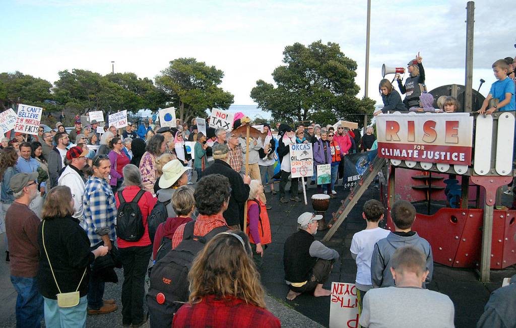 Climate Strike participants gather at the playground at Port Angeles City Pier before marching through the streets of Port Angeles on Friday evening. (Keith Thorpe/Peninsula Daily News)