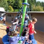 Playing on Brinnon Schools new playground equipment Wednesday are Connor Edwards, Savanah Hirschel, Cooper Edwards, Annika Morris and Ruby Hough. (Britney Edwards)