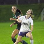 Keith Thorpe/Peninsula Daily News Port Angeles Hannah Reetz, left, and North Kitsaps Sarah Hamilton vie for a header on Thursday night at Port Angeles Civic Field.