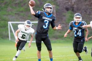 PREP FOOTBALL: Cowboys’ defense holds fast in 22-16 win over Klahowya