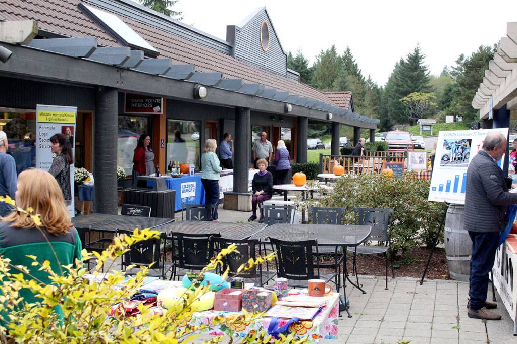 Attendees mingle at the business expo hosted in Port Ludlow by the Chamber of Jefferson County. (Zach Jablonski/Peninsula Daily News)