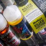 In this Sept. 16 photo flavored vaping solutions are shown in a window display at a vape and smoke shop in New York. Washington is joining several other states in banning the sale of flavored vaping products amid concern over the mysterious lung illness that has sickened hundreds of people and killed more than a dozen across the country. (Bebeto Matthews/The Associated Press)