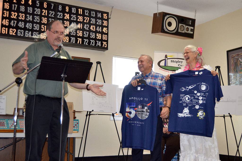 Michael Smith, executive director of Shipley Center, recognizes retired U.S. Air Force Col. Joey Lazzaro and his wife Mahina, who spoke in July at the center about Lazzaros time with the mission control team that oversaw operations during Apollo 11s landmark lunar landing 50 years ago. Matthew Nash/Olympic Peninsula News Group