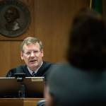 Clallam County Superior Court Judge Brent Basden congratulates Sandra Schroeder on completing drug court before dismissing charges against her. (Jesse Major/Peninsula Daily News)