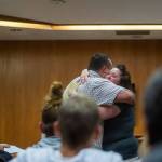 Jeffrey Haley, a counselor at Cedar Grove, embraces Sandra Schroeder as she graduates from drug court. (Jesse Major/Peninsula Daily News)