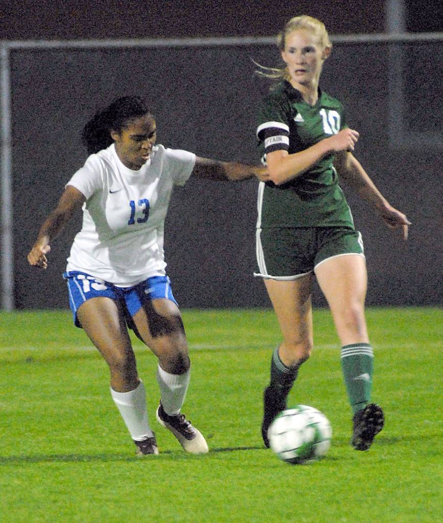 Port Angeles Millie Long, right, tries to outrace Bremertons Sydney Lane in the first half on Tuesday at Port Angeles Civic Field. Long scored two goals against the Knights, giving her 19 for the season. (Keith Thorpe/Peninsula Daily News)                                Port Angeles Millie Long, right, tries to outrace Bremertons Sydney Lane in the first half on Tuesday at Port Angeles Civic Field. Long scored two goals against the Knights, giving her 19 for the season. (Keith Thorpe/Peninsula Daily News)