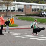 Crossing guard Kelly Hoch assists children crossing Lauridsen Boulevard in front of Franklin Elementary School in Port Angeles on Wednesday. (Keith Thorpe/Peninsula Daily News)