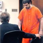 Shay C. Darrow, right, is greeted by attorney John Hayden as Darrow enters Clallam County Superior Court in Port Angeles on Thursday. (Keith Thorpe/Peninsula Daily News)