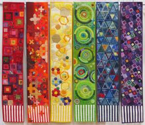 Geometry In Textiles by Betty Cook (red), Nancy Wilcox (orange), Mary Ann Clayton (yellow), Peggy St. George (green), Janet Green (blue) and Anne Davies (purple).