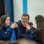Marc Abshire, director of the Port Angeles Regional Chamber of Commerce, chats with students during lunch at Stevens Middle School. (Jesse Major/Peninsula Daily News)