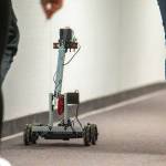 A robot drives through the hallway at Stevens Middle School. (Jesse Major/Peninsula Daily News)