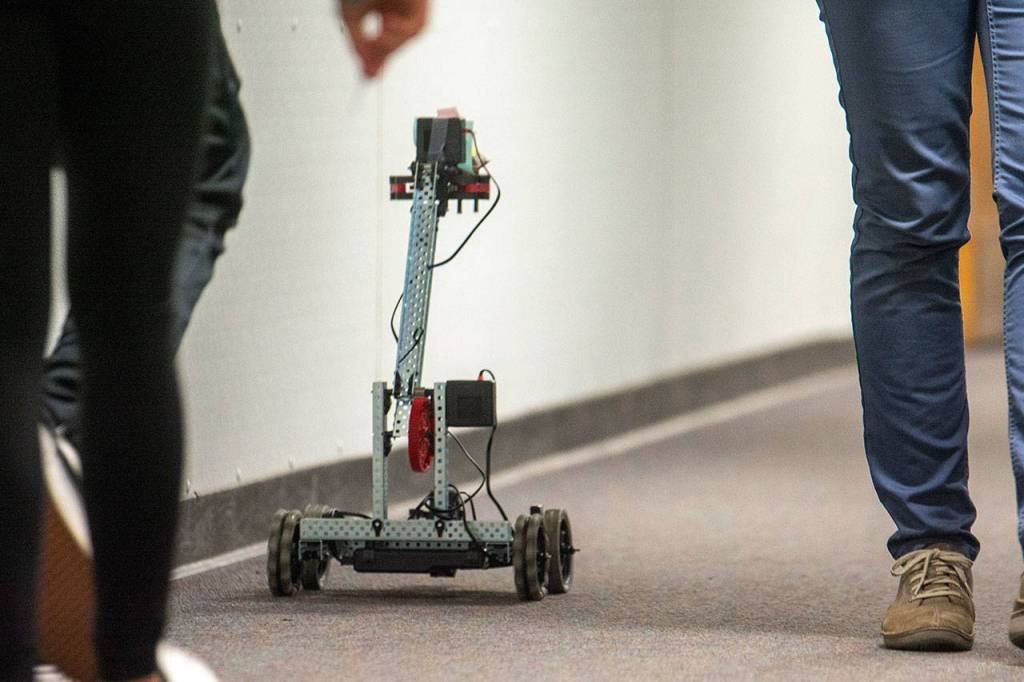 A robot drives through the hallway at Stevens Middle School. (Jesse Major/Peninsula Daily News)