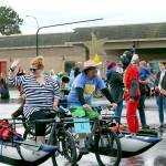 Skulpture Celestial Navigation with pilots Amber and Collin Bartl ride in the Art Parade on Saturday as they head to the break test and water portion of the Kinetic Race. The skulpture won the Lucky Duck award for the amount of duct tape that the team used throughout the weekends activities. (Zach Jablonski/Peninsula Daily News)