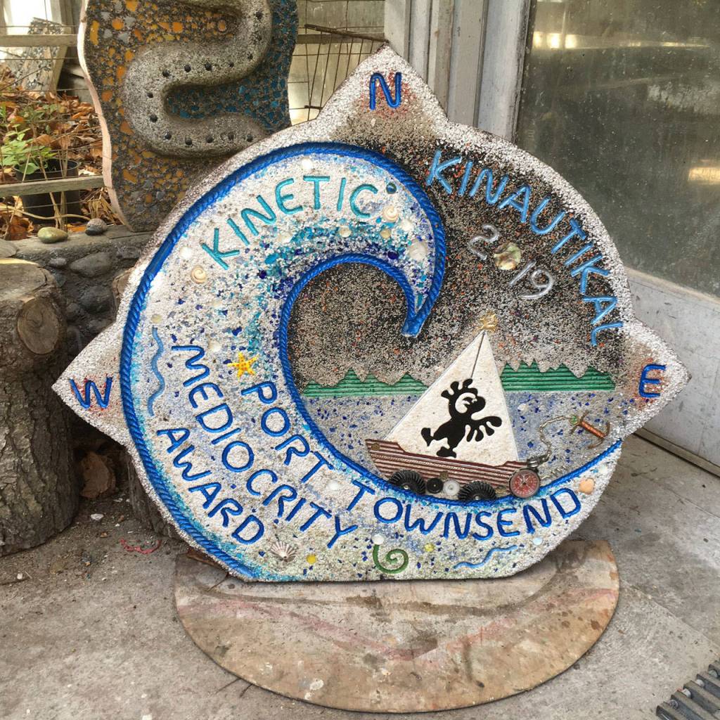 The Paver Award that was made by Top Kop John Lizwacko weighs more than 100 pounds. It was given to the Lobster Pot Family Man team as part of the earnings for the Mediocrity Award for finishing the race in the dead center of the pack. (Kinetic Race Facebook Page)