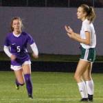 Conor Dowley/Olympic Peninsula News Group Port Angeles Roughriders forward Hannah Reetz (right) shows frustration after Mary McAleer (left, 5) cleared a pass intended for her in front of the Sequim Wolves goal on Oct. 8. Reetz and star forward Millie Long struggled for quality service into the final third because of the Wolves game plan in their 2-1 shootout win.