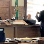 Jefferson County Superior Court Judge Keith Harper, left, listens to defense attorney Jake Range ask questions of Richard Stroud, a veterinary forensic pathologist. Stroud testified for the defense Wednesday that a number of factors could have led to the emaciated state of the bison, including toxic plants and parasites called liver flukes. (Brian McLean/Peninsula Daily News)