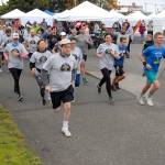 Runners and walkers take off from the start of Saturdays CrabFest 5K Run along the Waterfront Trail from Port Angeles City Pier. The race was a benefit for the Peninsula College womens basketball program. (Keith Thorpe/Peninsula Daily News)