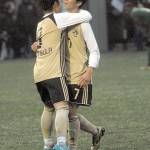 Peninsulas Hide Inoue is congratulated by teammate Yuya Yamamoto after Inoue scored a goal in the first half against Shoreline on Wednesday. (Keith Thorpe/Peninsula Daily News)