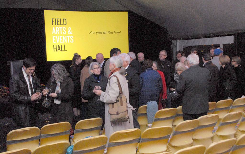 A group of groundbreaking guests mingle with champagne at conclusion of Friday nights ceremony. (Keith Thorpe/Peninsula Daily News)