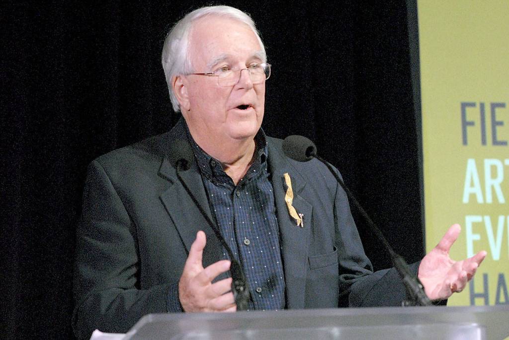 Brooke Taylor, board chairman for the non-profit Field Arts & Events Hall project, speaks about community involvement during Friday nights groundbreaking event a the project site at Front and Oak streets on the Port Angeles waterfront. (Keith Thorpe/Peninsula Daily News)