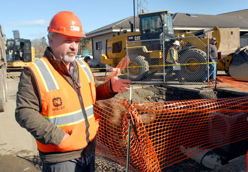 William Shore Memorial Pool District executive director Steve Burke explains how stormwater at the site of the Shore Aquatic Center will be collected as he conducts a tour of the site in Port Angeles. (Keith Thorpe/Peninsula Daily News)