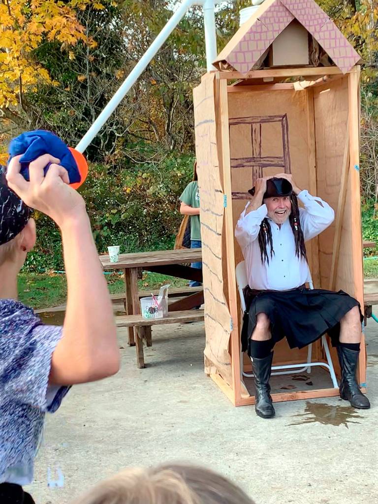 Brian Cullin, marketing director of Worthington Park, prepares to get wet in the dunker set up for the Halloween festival. (Melody Bacchus Smith)